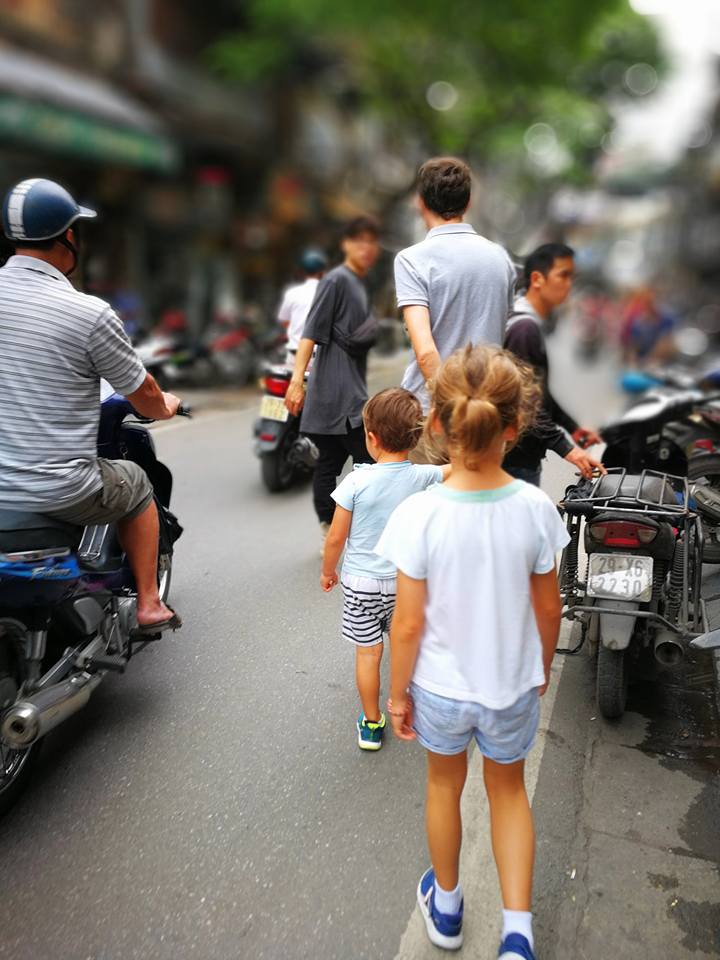 Navigating the busy streets of Hanoi under the guidance of our food guide from Ha Food Tour. 